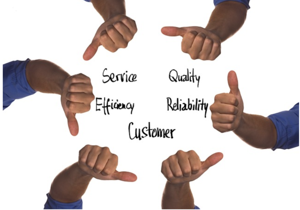 Hands with thumbs up or down for customer satisfaction