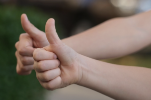 users with thumbs up to signify satisfaction