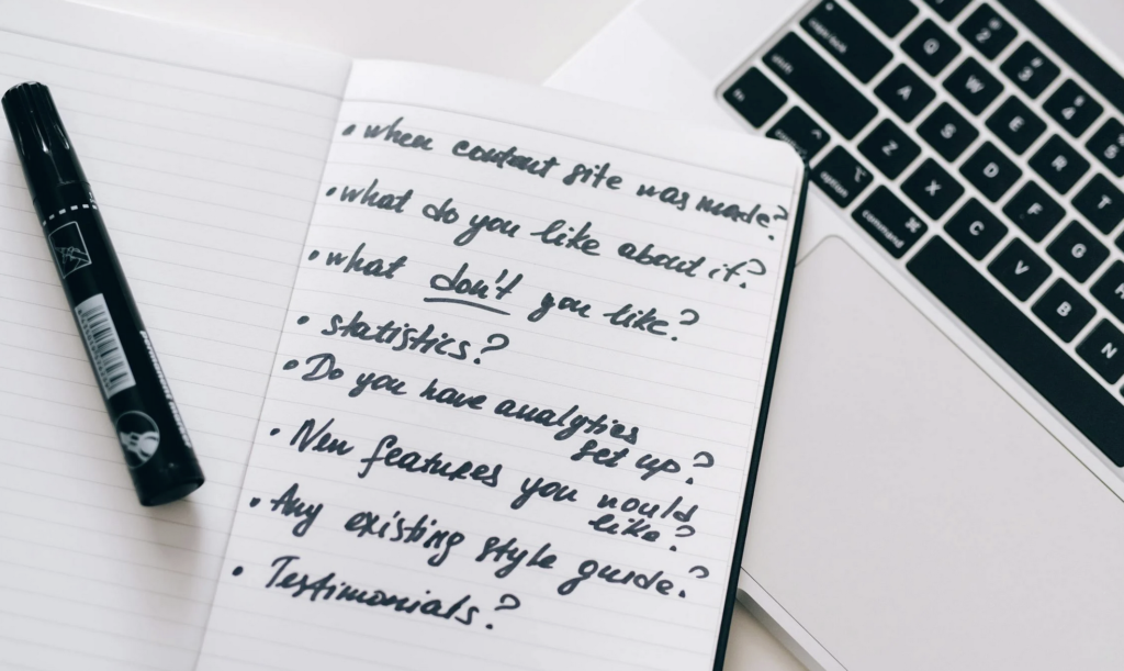 open ended questionnaire questions written in a note book