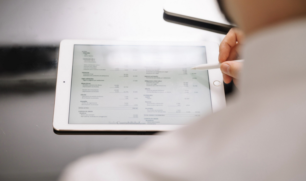 a person analysing the sample order form format example on a tablet